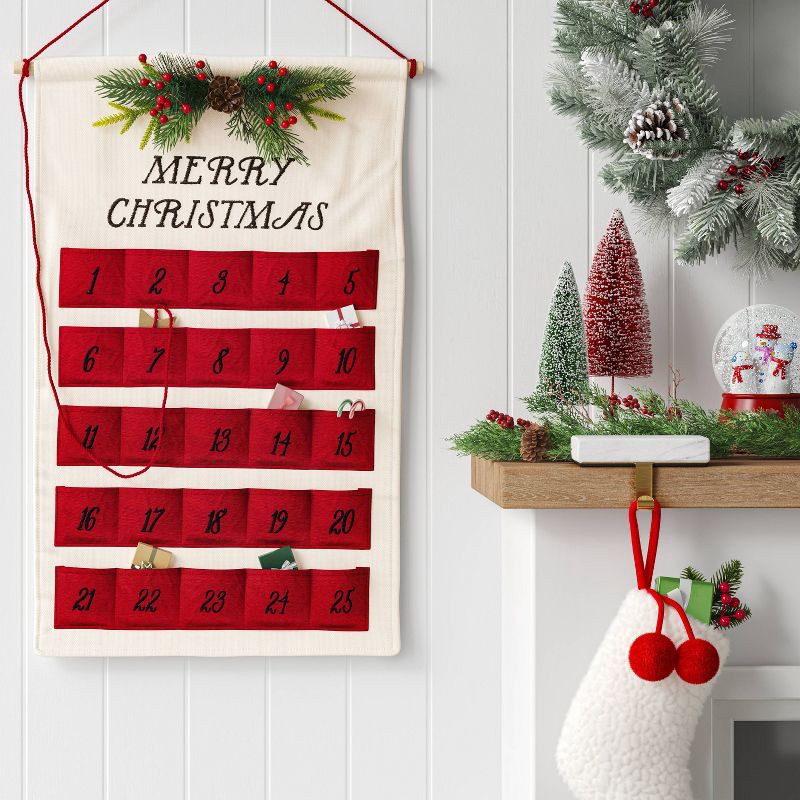 slide 2 of 4, 21.5" 'Merry Christmas' Fabric Hanging Advent Calendar with Faux Greenery and Star Counter Cream/Red - Wondershop™, 1 ct