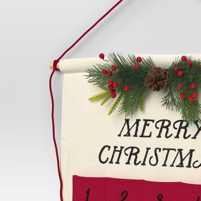 slide 4 of 4, 21.5" 'Merry Christmas' Fabric Hanging Advent Calendar with Faux Greenery and Star Counter Cream/Red - Wondershop™, 1 ct
