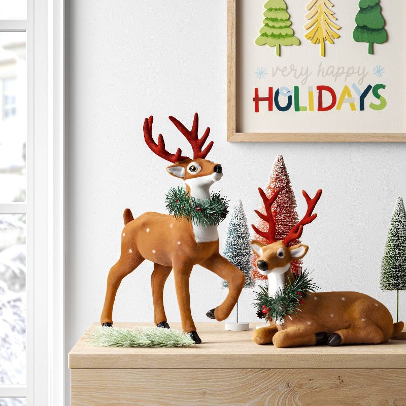 slide 2 of 3, Flocked Standing Deer with Faux Greenery Christmas Animal Figurine - Wondershop™ Brown, 1 ct