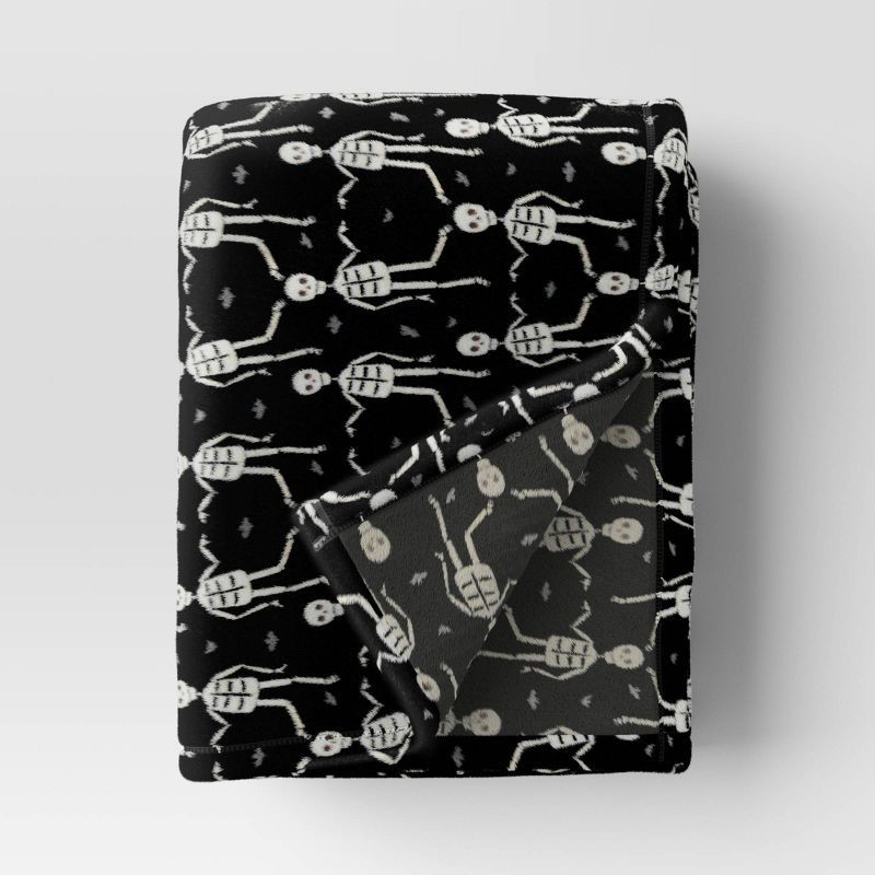 slide 1 of 4, Halloween Printed Skeleton Throw Blanket Black/Ivory - Hyde & EEK! Boutique™: Recycled Polyester, Knitted, 50x60", Machine Washable, 1 ct