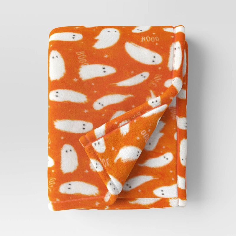 slide 1 of 5, Ghost Printed Plush Halloween Throw Blanket Orange/Ivory - Hyde & EEK! Boutique™: Lightweight, Knitted, Recycled Polyester, 50x60", 1 ct