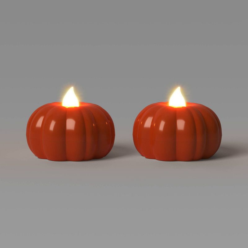slide 1 of 3, 2pk LED Pumpkin Shaped Halloween Tea Lights with Warm Orange Flickering Flame - Hyde and EEK! Boutique™, 2 ct