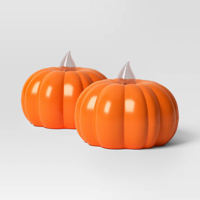 slide 3 of 3, 2pk LED Pumpkin Shaped Halloween Tea Lights with Warm Orange Flickering Flame - Hyde and EEK! Boutique™, 2 ct