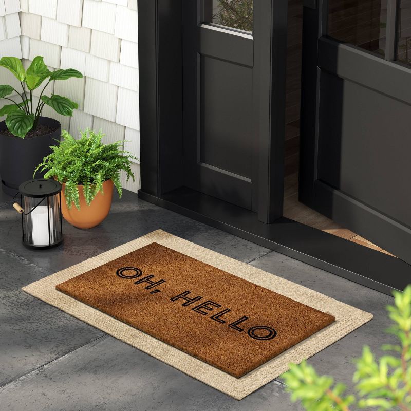 slide 2 of 4, 1'4"x2'4" Oh Hello Rectangular Outdoor Doormat Black - Room Essentials™, 1 ct
