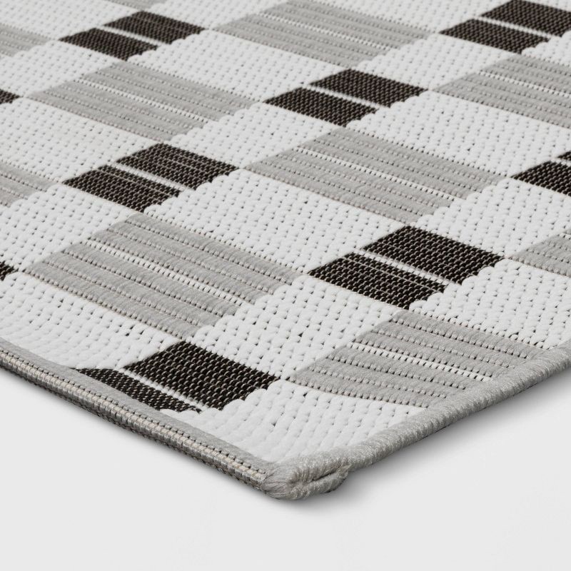 slide 3 of 4, 3'11"x5'5" Checkered Rectangular Indoor Outdoor Area Rug Black - Room Essentials™, 1 ct