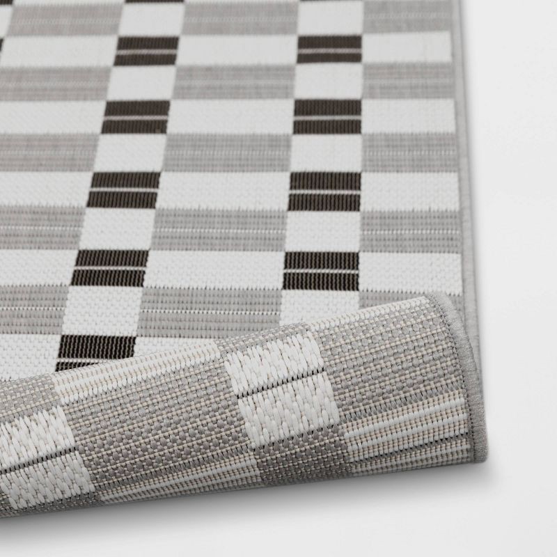 slide 4 of 4, 3'11"x5'5" Checkered Rectangular Indoor Outdoor Area Rug Black - Room Essentials™, 1 ct