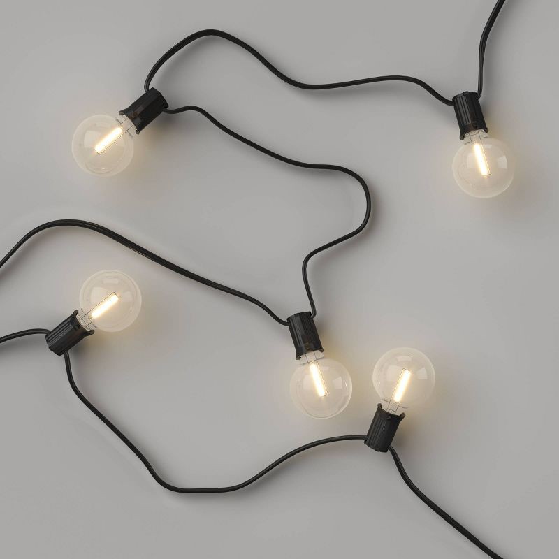 slide 3 of 4, 20ct LED Indoor Outdoor Globe String Lights Clear Bulbs with Black Wire - Room Essentials™, 20 ct
