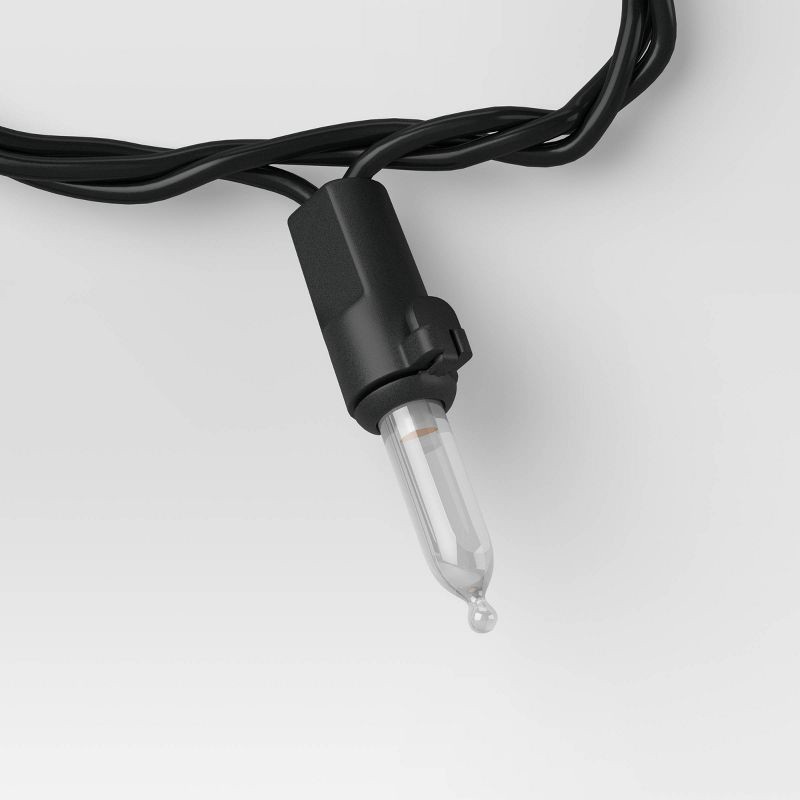 slide 4 of 4, 100ct LED Indoor Outdoor Miniature String Lights Clear Bulbs with Black Wire - Threshold™, 100 ct
