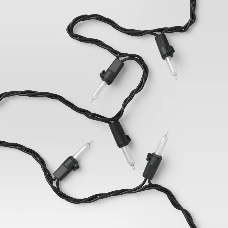 slide 1 of 4, 100ct LED Indoor Outdoor Miniature String Lights Clear Bulbs with Black Wire - Threshold™, 100 ct