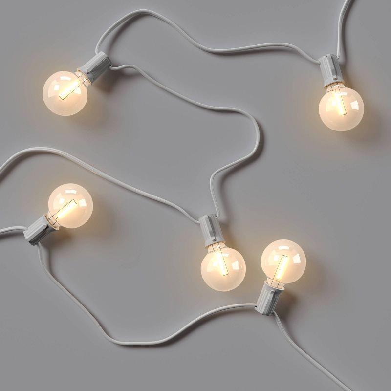 slide 3 of 4, 20ct LED Indoor Outdoor Globe String Lights Clear Bulbs with White Wire - Room Essentials™, 20 ct