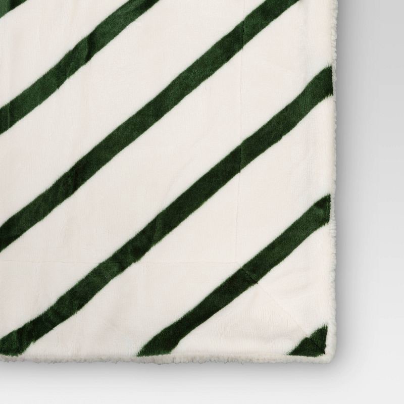 slide 4 of 5, Candy Cane Striped Printed Plush Throw Blanket with Faux Shearling Reverse Ivory/Green - Threshold™, 1 ct