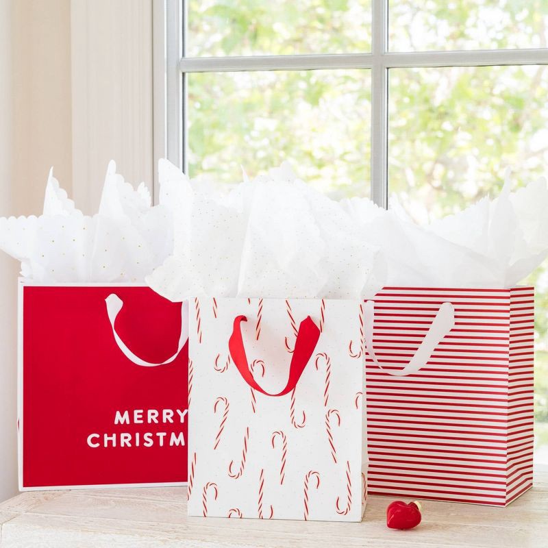 slide 2 of 2, 4ct Candy Cane and Stripe Cub Gift Bags - Sugar Paper + Target, 4 ct