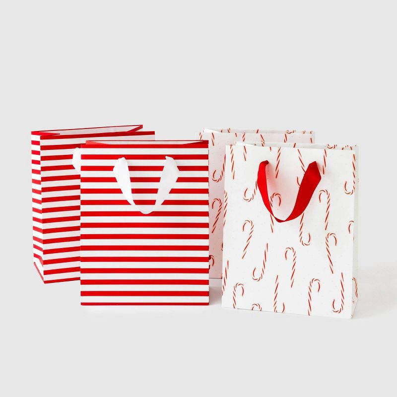 slide 1 of 2, 4ct Candy Cane and Stripe Cub Gift Bags - Sugar Paper + Target, 4 ct