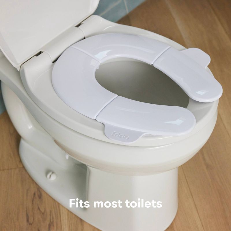 slide 3 of 7, Frida Baby Fold n Go Potty Toilet Training Seat - White, 1 ct