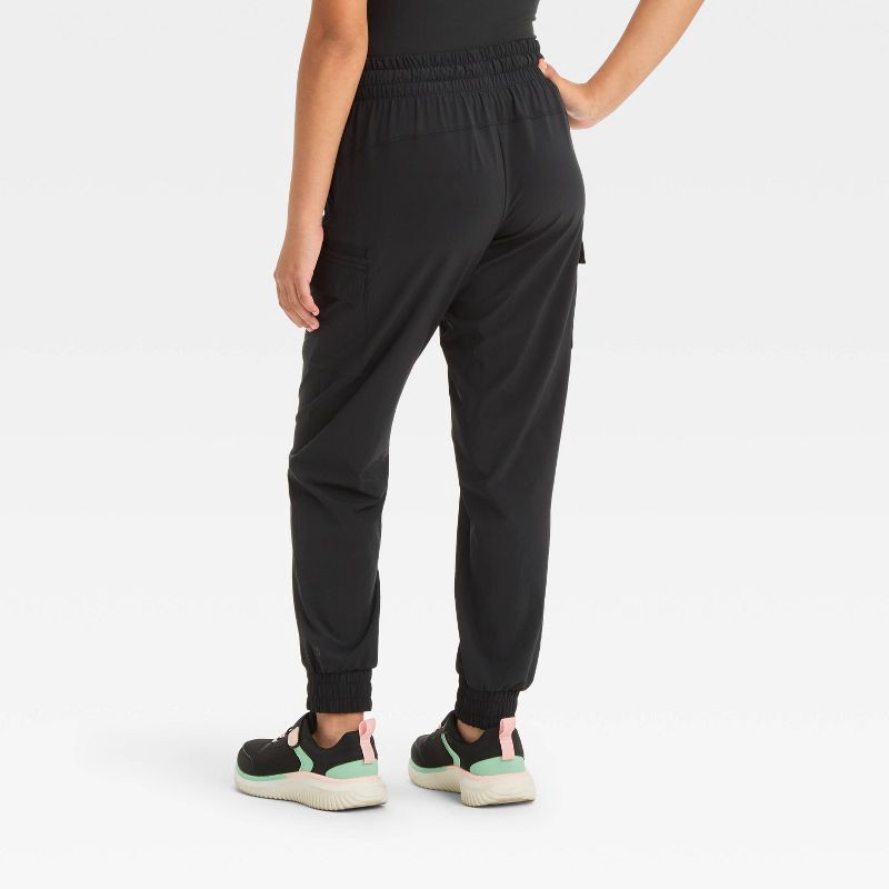 slide 2 of 3, Girls' Woven Cargo Jogger Pants - All In Motion™ Black XS: Midweight, Moisture Wicking, Quick Dry, 4-Way Stretch, Pull-On, 1 ct