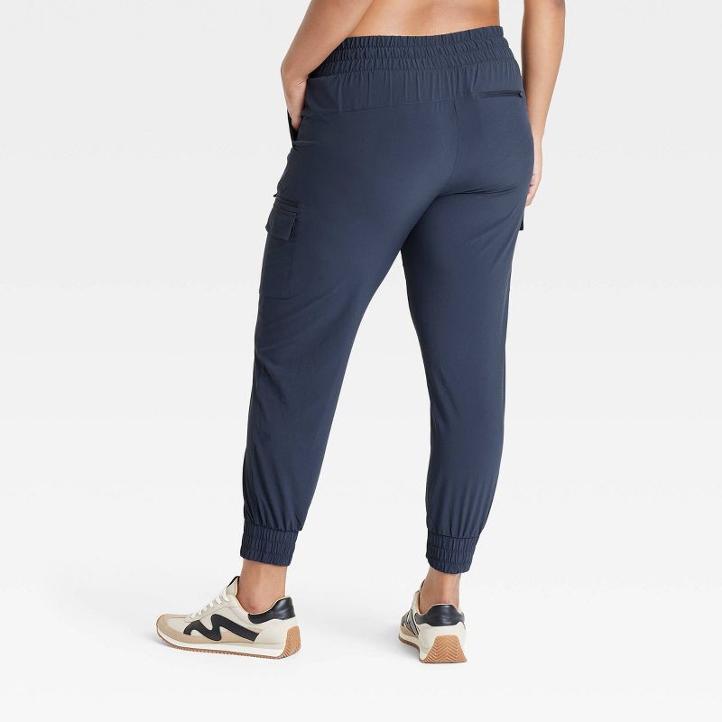 slide 4 of 5, Women's Active Light Mid-Rise Cargo Jogger Pants - All In Motion™ Navy Blue S: Moisture Wicking, Quick Drying, 1 ct