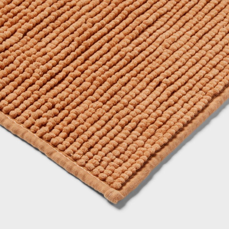 slide 3 of 4, 17"x24" Everyday Chenille Bath Rug Copper - Room Essentials™, 1 ct