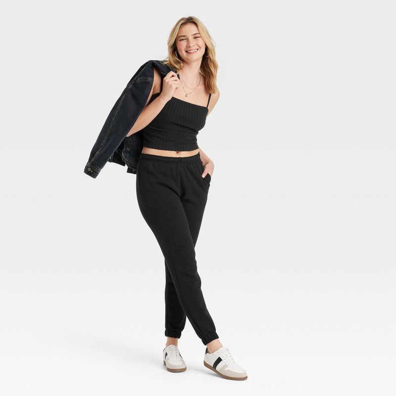 slide 3 of 3, Women's Leisure Studio Mid-Rise Fleece Essential Joggers - Universal Thread™ Black S: Cotton Fleece, Relaxed Leg, 1 ct