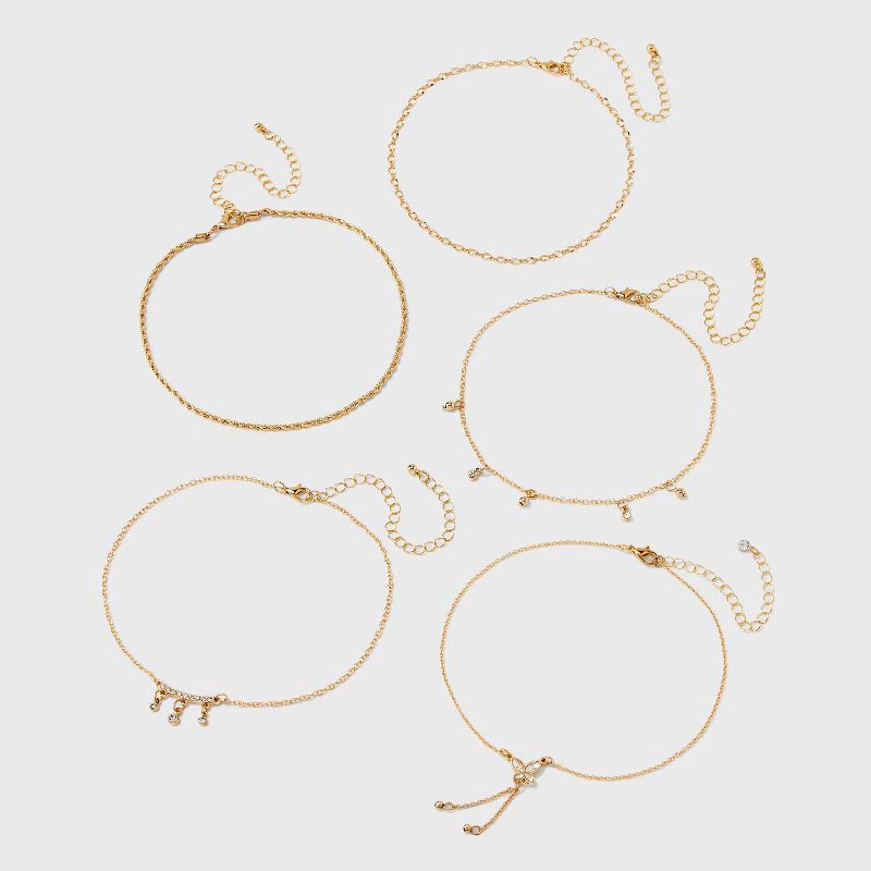 slide 2 of 3, Curved Bar and Butterfly Charm Choker Necklace Set 5pc - Wild Fable™ Gold: Iron, Glass, Zinc Alloy, 5 ct