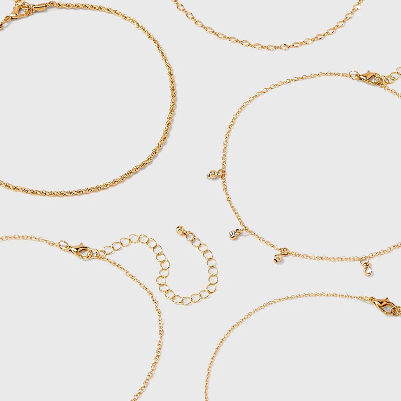 slide 3 of 3, Curved Bar and Butterfly Charm Choker Necklace Set 5pc - Wild Fable™ Gold: Iron, Glass, Zinc Alloy, 5 ct