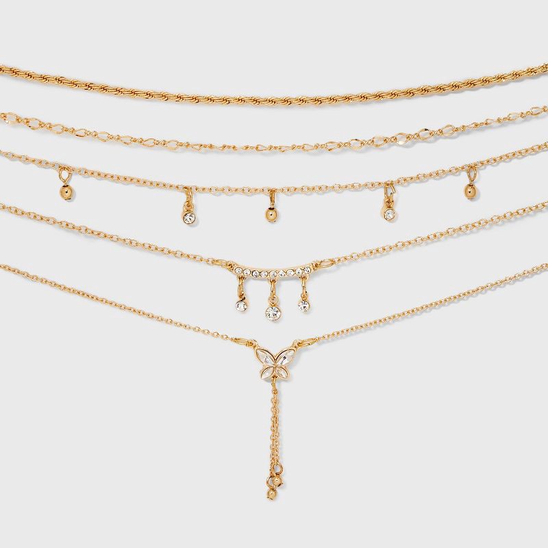 slide 1 of 3, Curved Bar and Butterfly Charm Choker Necklace Set 5pc - Wild Fable™ Gold: Iron, Glass, Zinc Alloy, 5 ct