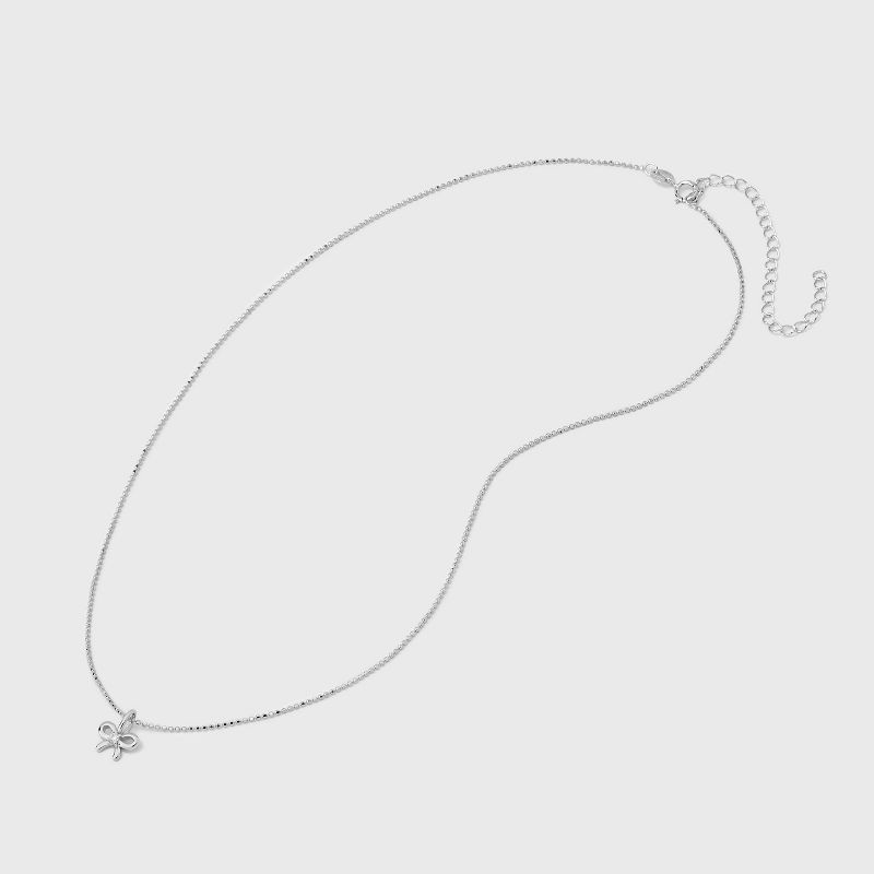slide 3 of 4, Sterling Silver Polished Bow with Center Cubic Zirconia Pendant Necklace - A New Day™ Silver: Ball Chain, Spring Ring Clasp, 19.4" Length, 1 ct