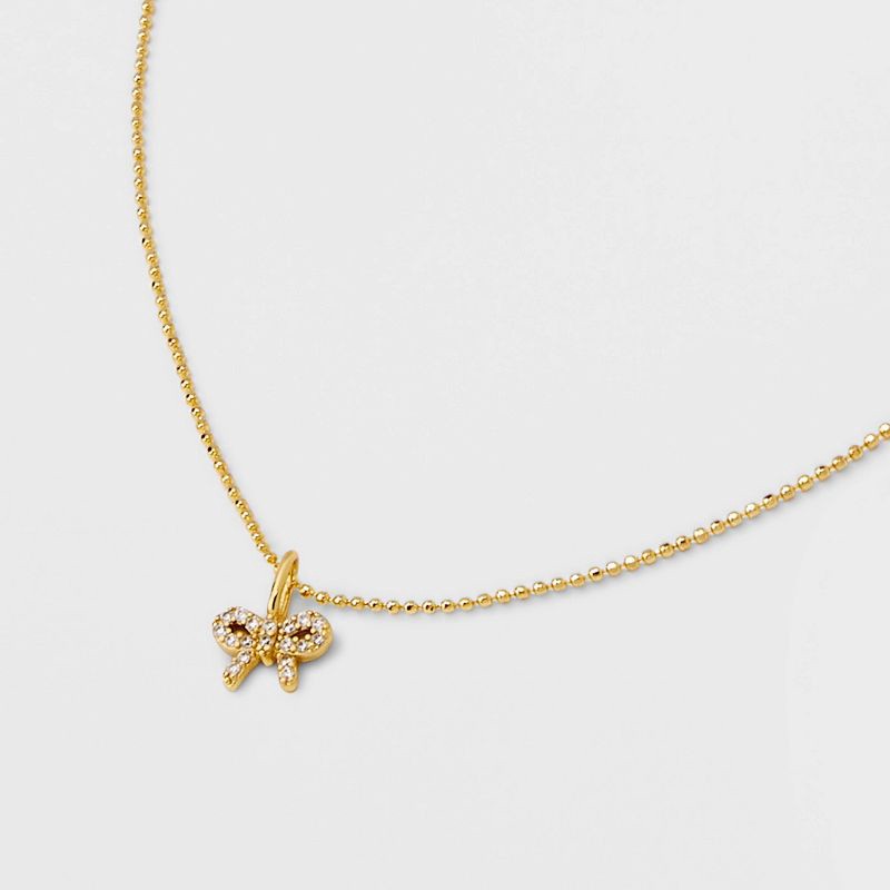 slide 4 of 4, 14K Gold Plated Brass Pave Cubic Zirconia Bow Necklace - A New Day™ Gold: Nickel-Free, 19" with Extender, 1 ct