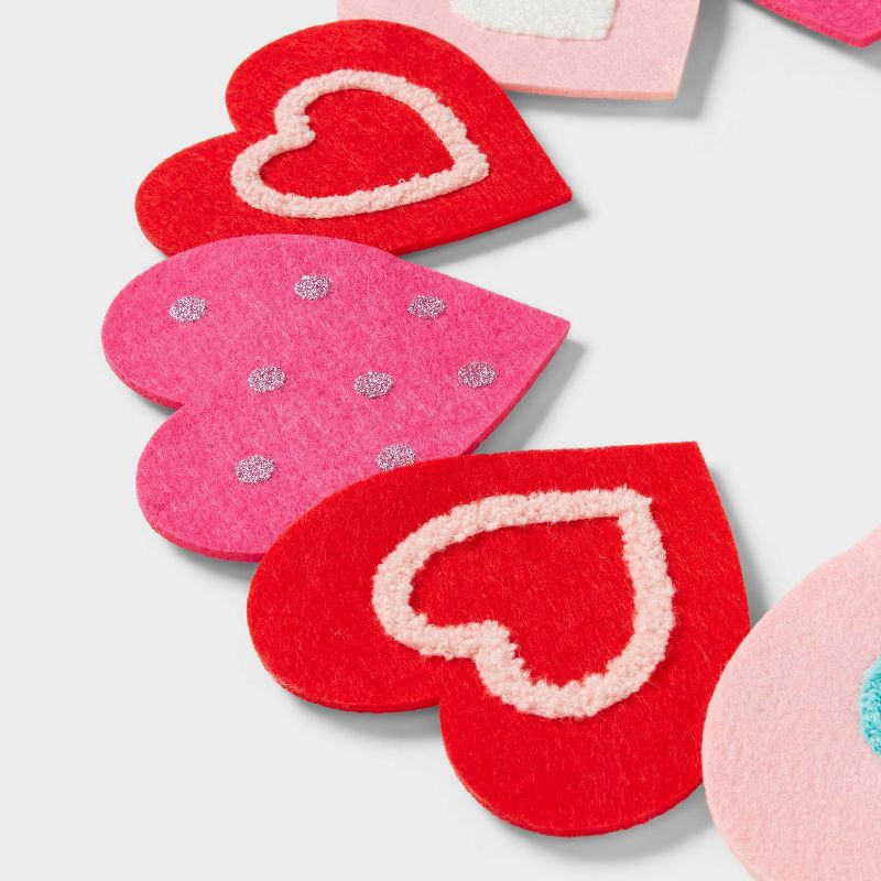 slide 3 of 3, 16" Felt Heart Wreath Valentine's Day Decorative Wall Decor - Spritz™, 1 ct