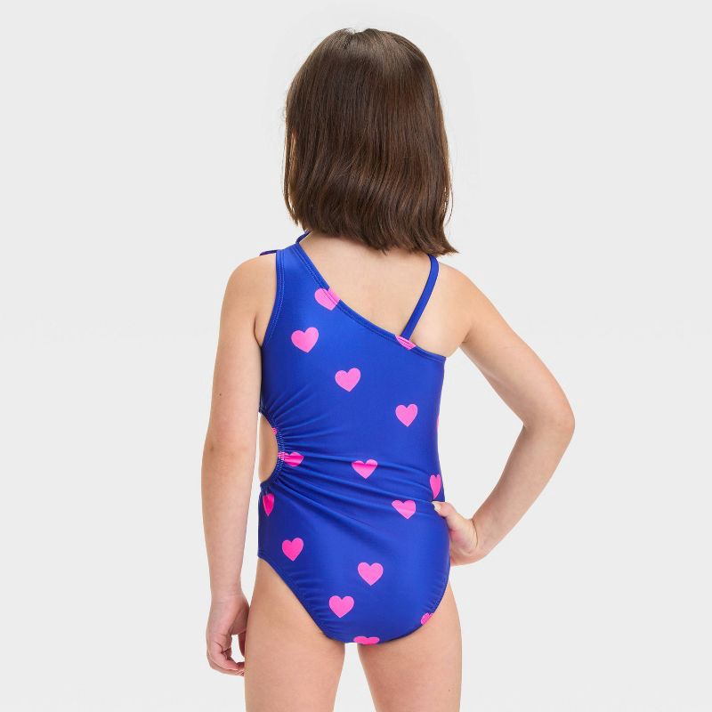 slide 2 of 3, Baby Girls' Heart Printed Cut Out One Piece Swimsuit With Bow - Cat & Jack™ Blue 18M: Asymmetrical Back, UPF 50+, Elastic Leg Openings, 1 ct