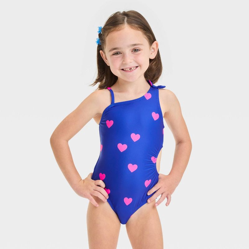 slide 1 of 3, Baby Girls' Heart Printed Cut Out One Piece Swimsuit With Bow - Cat & Jack™ Blue 18M: Asymmetrical Back, UPF 50+, Elastic Leg Openings, 1 ct