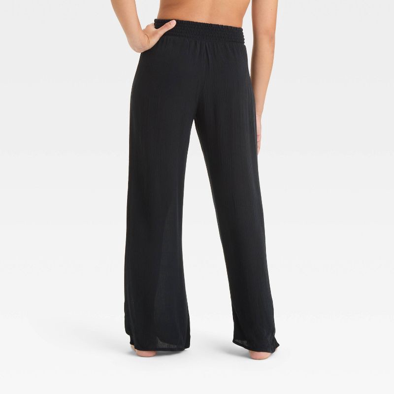 slide 2 of 3, Girls' Solid Cover Up Pants - art class™ Black L: Mid Rise, Side Pocket, UPF 50+ Protection, 1 ct