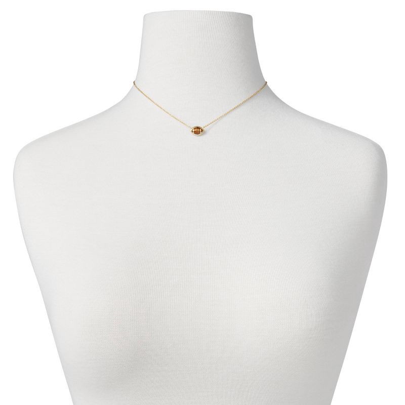 slide 3 of 3, Kendra Scott Enamel Football Pendant Necklace - Gold/Brown: 14K Gold Over Brass, Lobster Claw Clasp, 19" Length, 1 ct