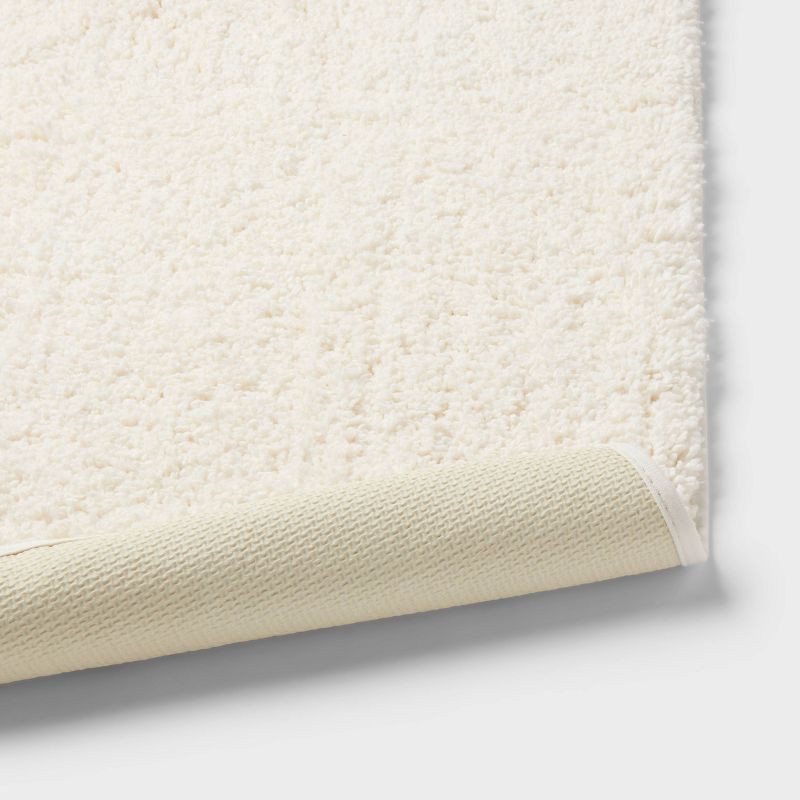 slide 4 of 4, 20"x34" Performance Plus Plush Non Skid Bath Rug Cream - Threshold™, 1 ct