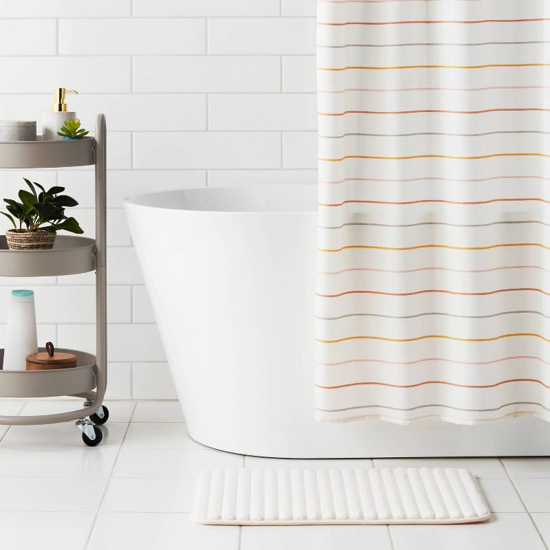 slide 2 of 4, 17"x24" Ribbed Cushion Foam Bath Rug Cream - Room Essentials™, 1 ct