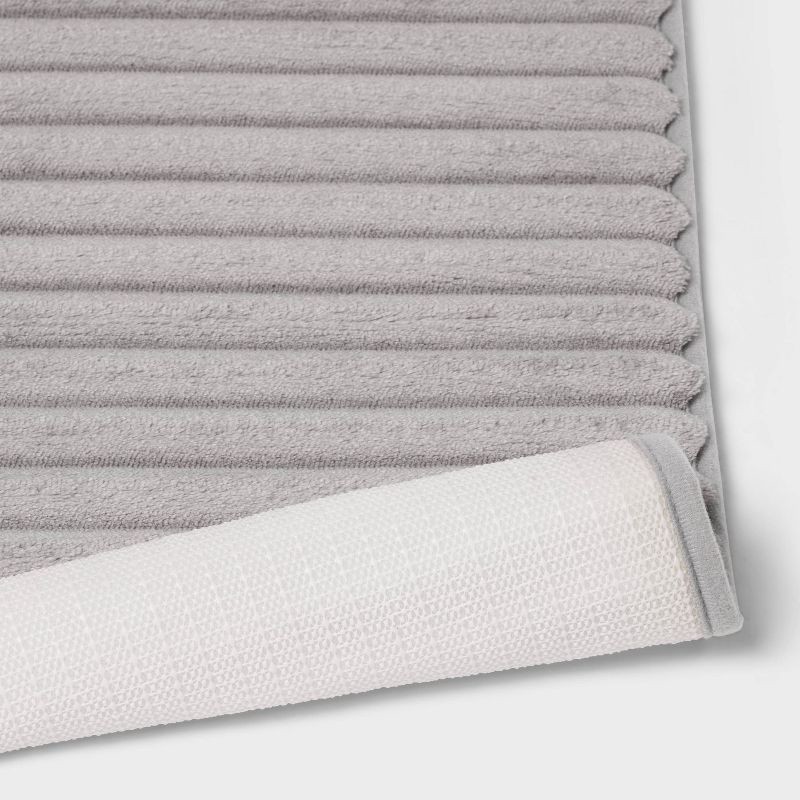 slide 4 of 4, 17"x24" Ribbed Cushion Foam Bath Rug Light Gray - Room Essentials™, 1 ct
