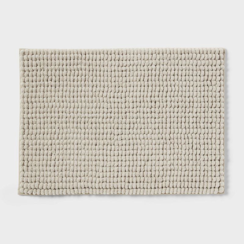 slide 1 of 4, 17"x24" Chunky Chenille Cushion Foam Bath Rug Tan - Room Essentials™, 1 ct