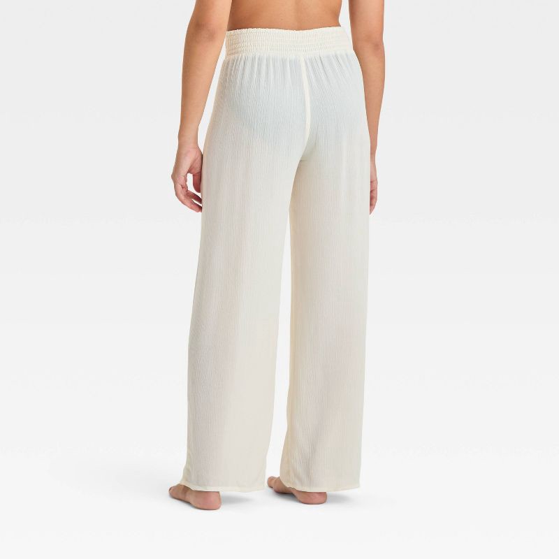 slide 2 of 3, Girls' Solid Cover Up Pants - art class™ Cream M: Mid Rise, Side Pocket, UPF 50+, 1 ct