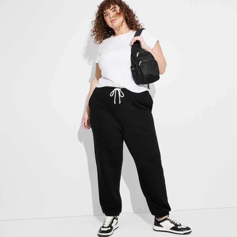 slide 1 of 3, Women's High-Rise Slim Fit Joggers - Wild Fable™ Black XXL: Cotton Fleece, Elastic Waist, 29" Inseam, 1 ct