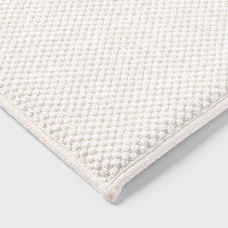 slide 3 of 4, 20"x34" Performance Plus Cotton Memory Foam Bath Rug Cream - Threshold™, 1 ct