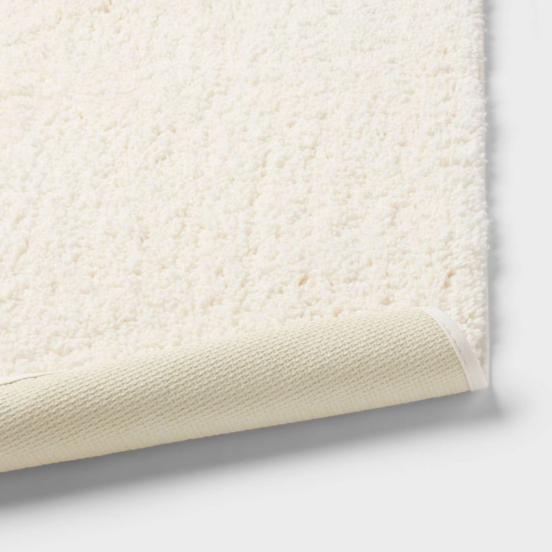 slide 4 of 4, 24"x38" Performance Plus Plush Non Skid Bath Rug Cream - Threshold™, 1 ct