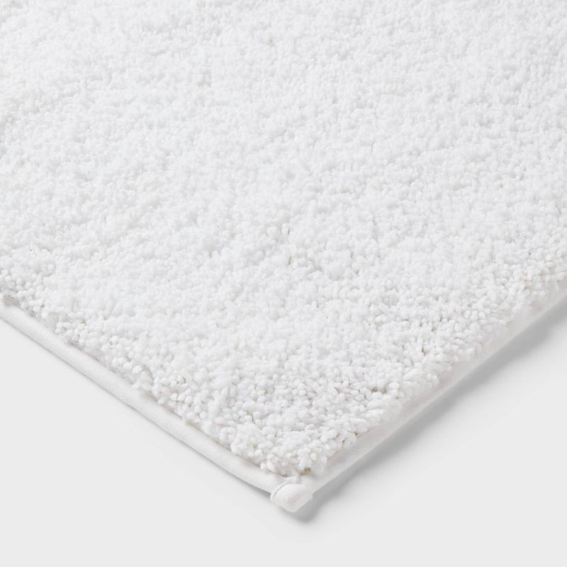 slide 3 of 4, 24"x38" Performance Plus Plush Non Skid Bath Rug White - Threshold™, 1 ct