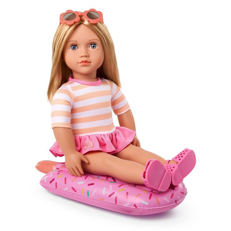 slide 3 of 5, Our Generation Margot 18" Doll with Swimsuit and Pink Pool Float Accessory: Hair Blonde, Blue Eyes, Beach Theme, 1 ct