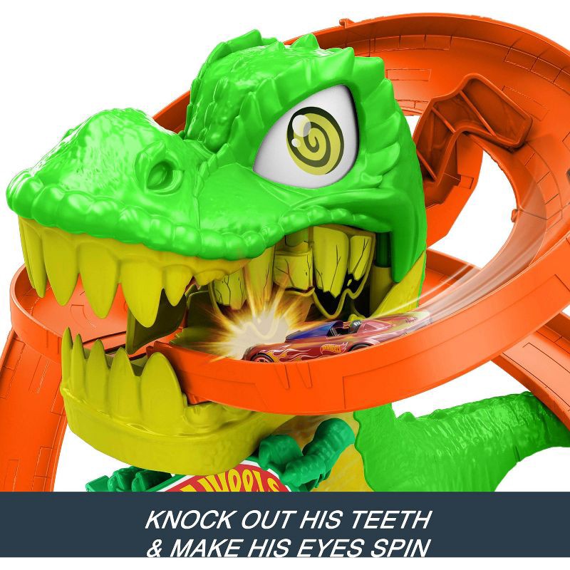 slide 4 of 6, Hot Wheels Diecast City T-Rex Blaze Battle Playset 1:64 Scale Dinosaur Nemesis, 1 ct