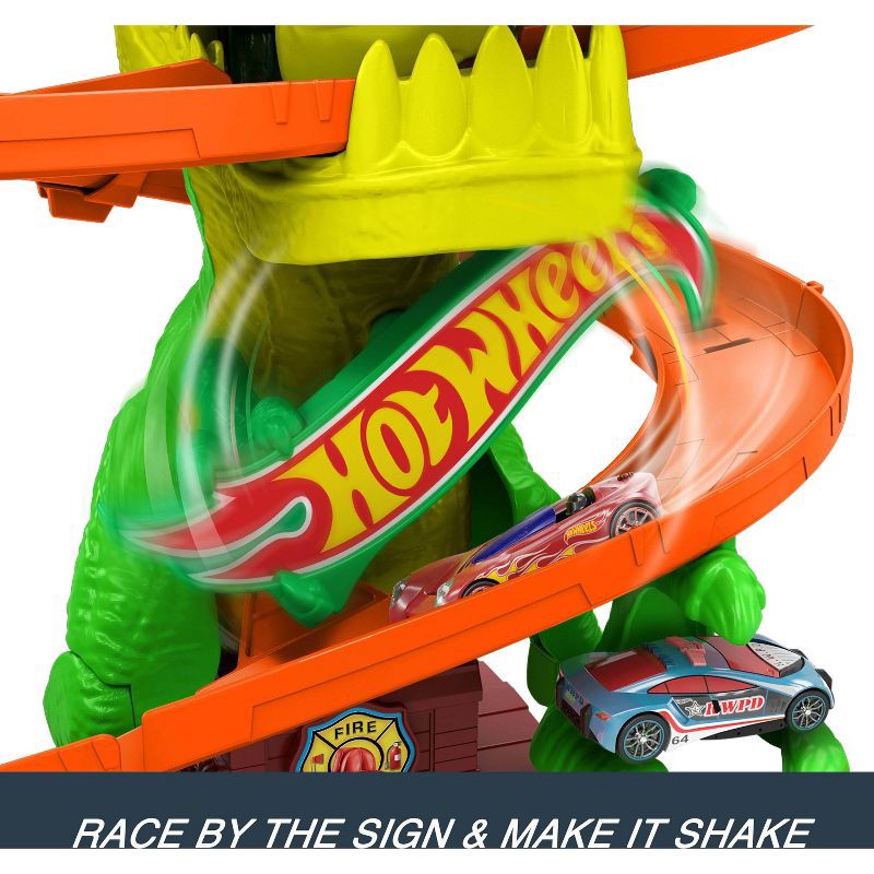 slide 5 of 6, Hot Wheels Diecast City T-Rex Blaze Battle Playset 1:64 Scale Dinosaur Nemesis, 1 ct