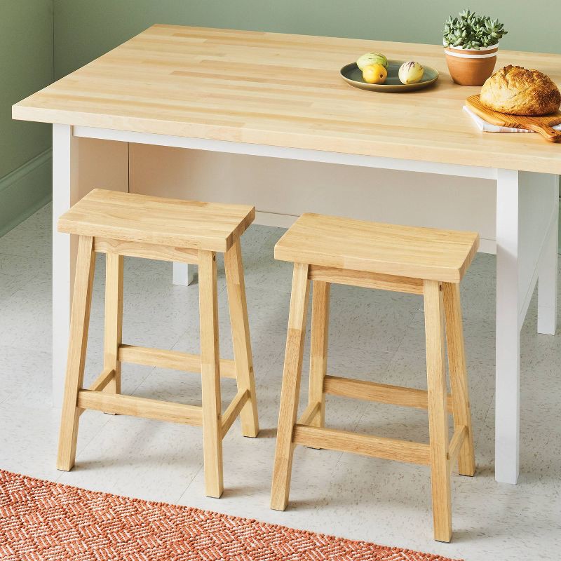 slide 2 of 6, Set of 2 24" Solid Wood Backless Saddle Counter Height Barstools Natural - Room Essentials™, 1 ct