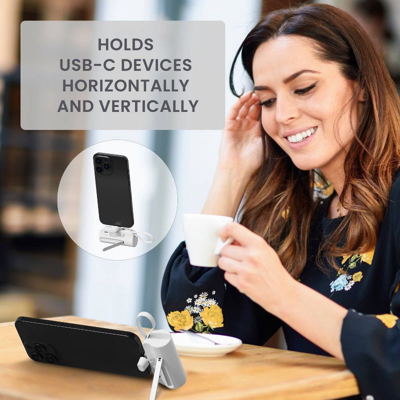 slide 6 of 8, Travel Smart Phone Stand 5000mAh Power Bank: Built-In Cable, Charges 2 Devices Simultaneously, 1 ct