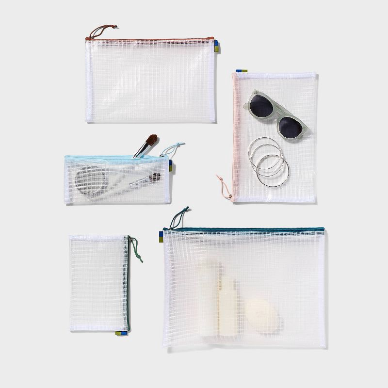 slide 2 of 3, 5pc Clear Toiletry Set - Open Story™️: Travel Cosmetic Storage Pouches, 5 ct
