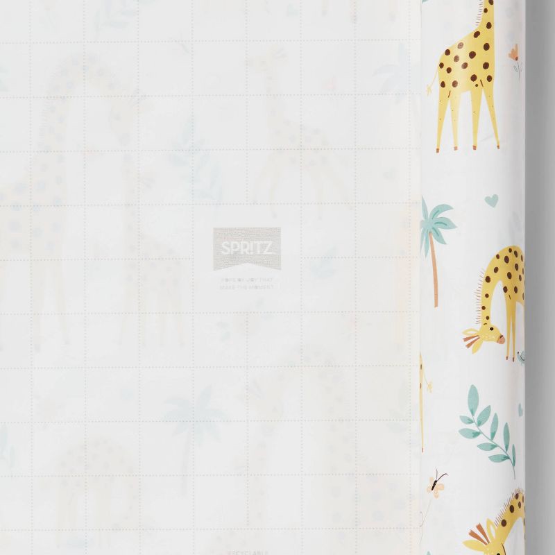 slide 3 of 3, 96"x30" Giraffe Baby Shower Gift Wrapping Paper White/Yellow - Spritz™, 1 ct