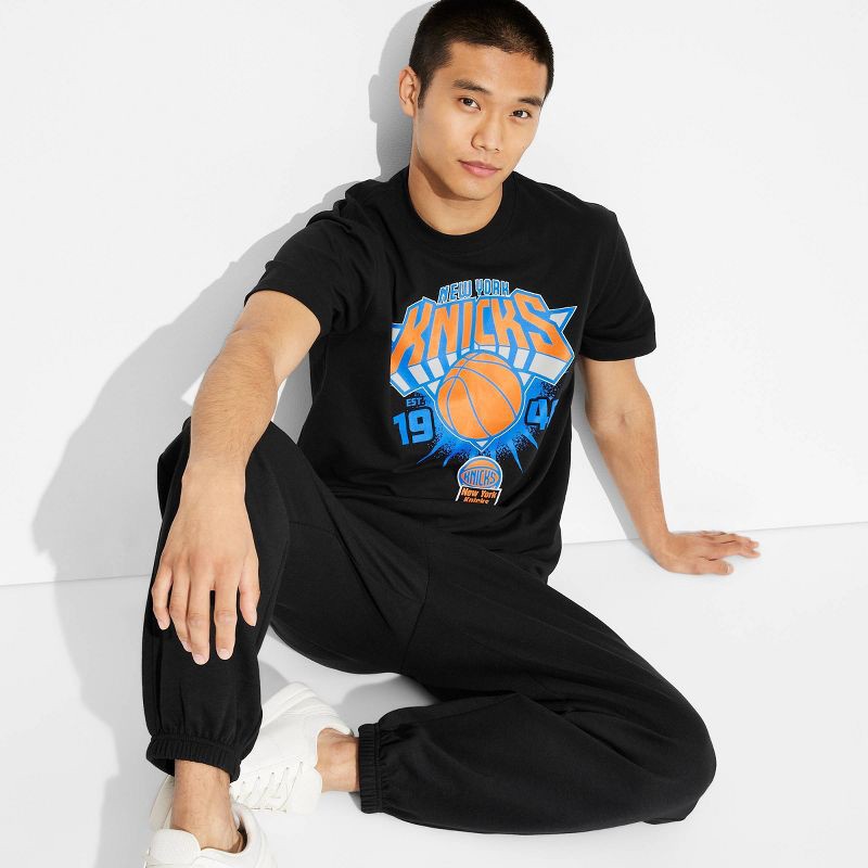slide 1 of 3, Men's Short Sleeve NY Knicks Graphic T-Shirt - Original Use™ Black S, 1 ct