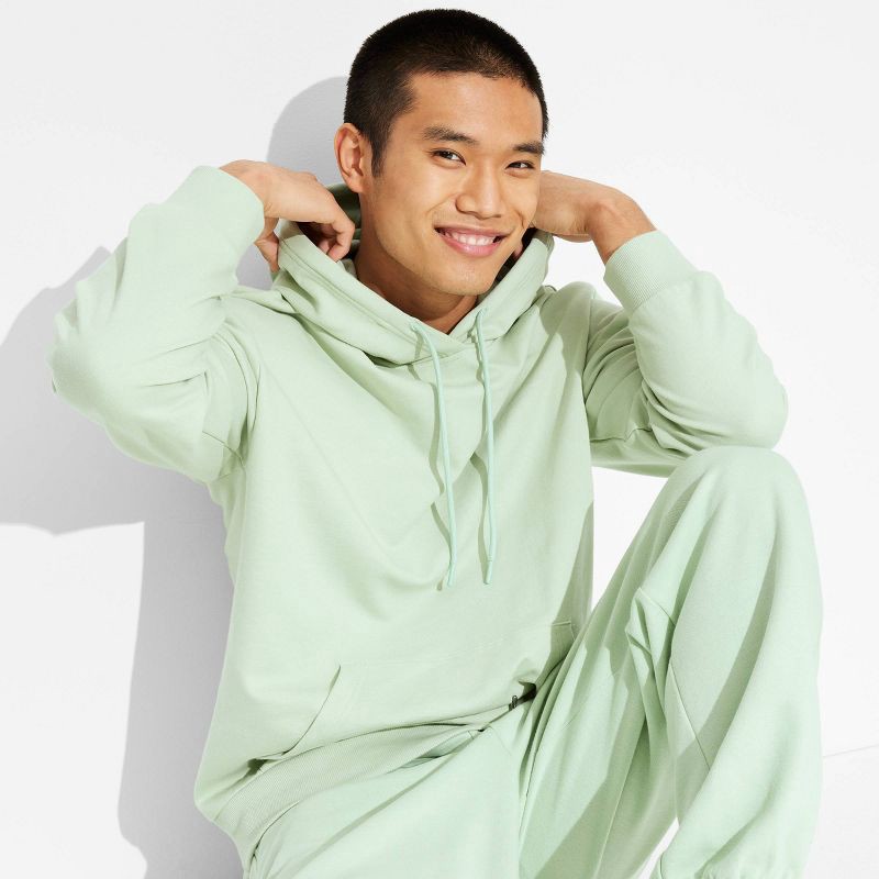 slide 1 of 3, Men's Oversized Fit Hooded Pullover Sweatshirt - Original Use™ Light Green L: Midweight French Terry, Kangaroo Pocket, 1 ct